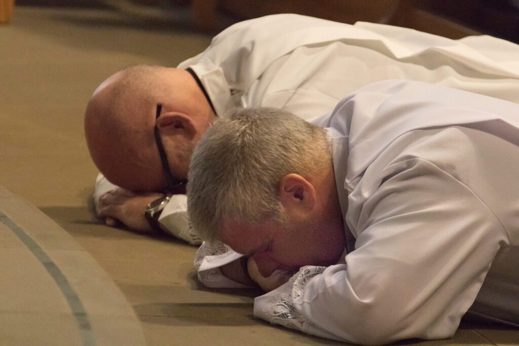 John Gilliver (closest to camera) and Martin Frain prostrate themselves before the Sanctuary during their Ordination as Deacons.